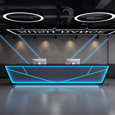 Industrial style club reception desk front view with black angular panels and blue lighting