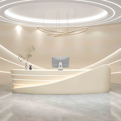 Curved lobby reception desk front view with sweeping cream curved panels