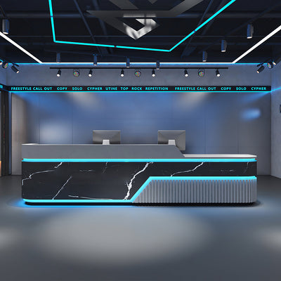 Reception desk front view with black marble-look panels, blue lighting and a fluted end