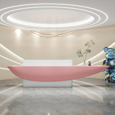 Boat-shaped reception desk front view with a pink boat-shaped counter