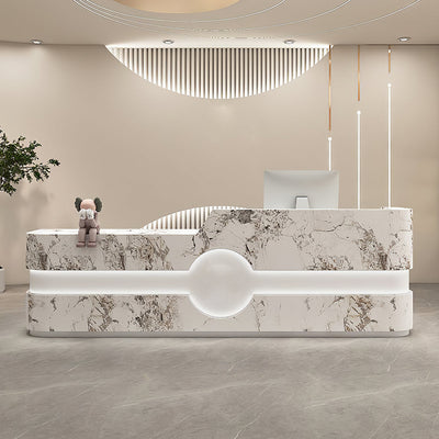 Curved salon reception desk front view with a marble-look curved panel