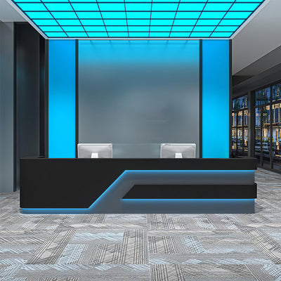 Industrial style club reception counter front view with black angular panels and blue lighting