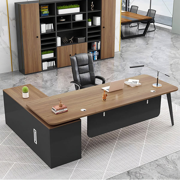 Modern L-shaped executive desk with Modesty Panel and Cable Management in mid-tone finish, shown in an executive office