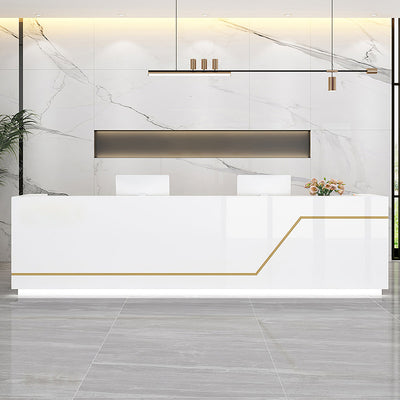 Office reception desk front view with a white panel and gold line detail