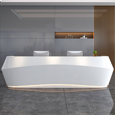 Lobby reception desk front view with faceted white curved panels and base lighting