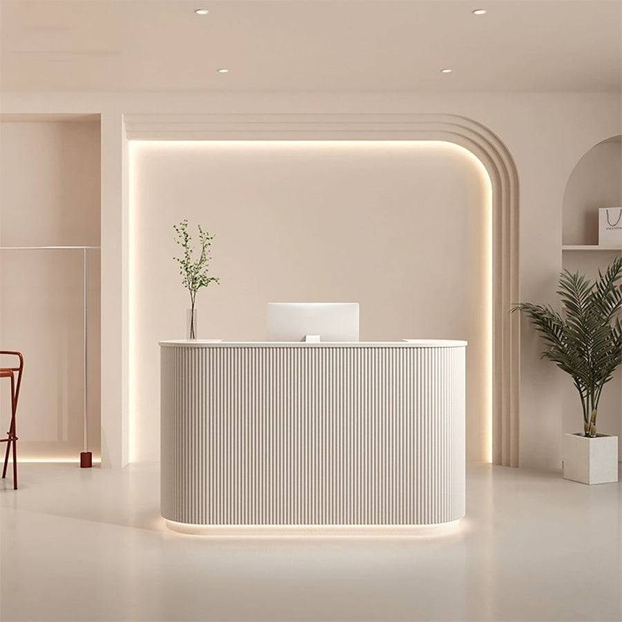 Semi-circular salon reception desk front view with a compact white fluted curved panel