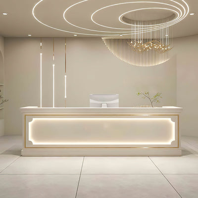 Salon reception desk front view with a framed white panel and illuminated trim