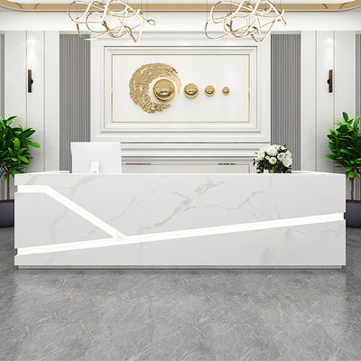 Reception desk front view with white marble-look geometric panels