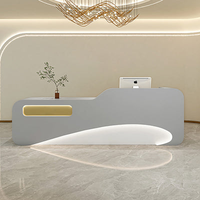 Beauty salon reception counter front view with a grey curved panel and inset lighting