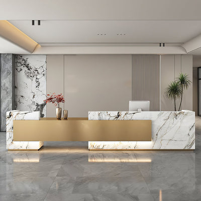 Office lobby reception desk front view with white marble-look panels and a gold centre panel