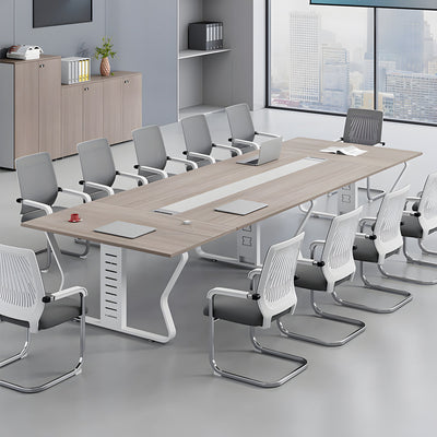 Light walnut conference table with cable management in an office