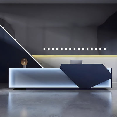 Company lobby reception desk front view with black and white geometric panels and illuminated trim