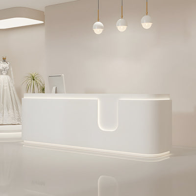 Curved salon reception desk angled front view with a white curved counter and central cut-out