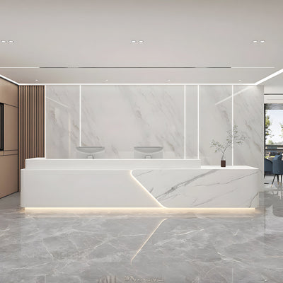 Office lobby reception desk front view with white marble-look asymmetrical panels and lighting